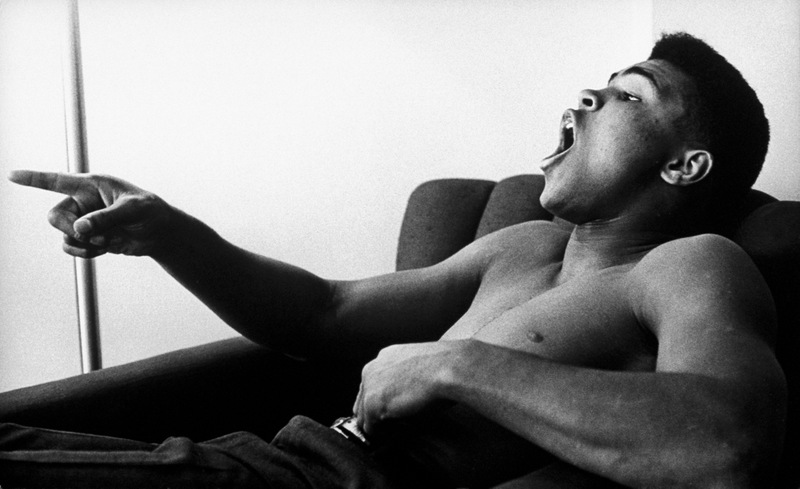 January 1963 - Pittsburgh: Boxing heavyweight contender Cassius Clay (now Muhammad Ali) reclining bare-chested in hotel room and pointing finger while expounding on boxing. ()Marvin Lichtner/Collection/Getty Images/The LIFE Images